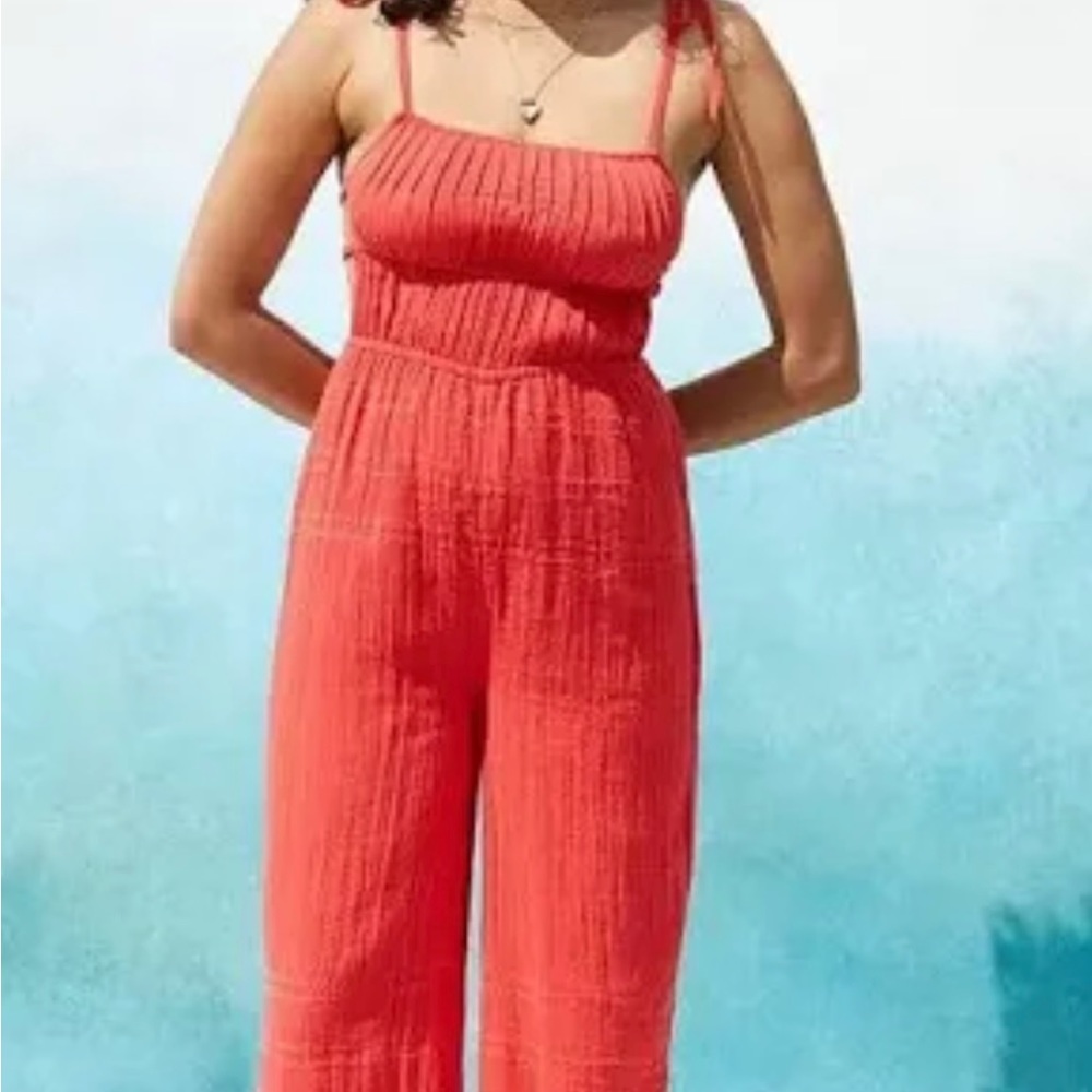 Urban Outfitter / reddish Orange jumpsuit with ties on the side Size M